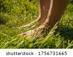 Women with barefeet standing in the grass
