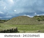 Small photo of Altar of circle 2 surrounded by patio and banquette with platforms. Guachimontones circular pyramid ruins with green grass and blue sky. One of the Teuchitlan Culture sites within the Tequila Valleys.
