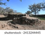 Small photo of Closer look at banquette with platforms of Circle 4 of Guachimontones circular pyramid ruins with green grass and blue sky. One of the Teuchitlan Culture sites within the Tequila Valleys.
