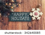 happy Holiday written on wooden background 