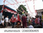 Small photo of Tangerang, Indonesia - August 17 2023 : Hijab woman is having competition for seats or "Rebut Kursi" to commemorate indonesia's independence day