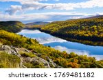 Lake of the Clouds in Porcupine Mountains Wilderness State Park, Michigan’s largest state park. Amazing natural beauty in fall season and gorgeous blue clouds reflection in water.