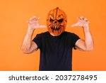 Man Wearing Scary Pumpkin Latex ...