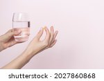 Woman Holding Pill And Glass Of ...