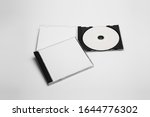 Open and close compact plastic disc box case set with white isolated blank for branding design. CD jewel mock-up on soft gray background. DVD or CD disc