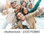 Small photo of Multiracial best friends having fun outside - Group of young people smiling at camera outdoors - Friendship concept with guys and girls hanging out on city street