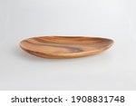 Empty oval wooden tray on a white back ground.