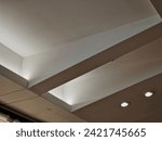  ceiling of the corridor in the plasterboard soffit is equipped with light halogens illuminating the ramp on the stage or in the shop. the goods look better if there are strong lamps in the ceiling
