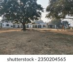 Small photo of old building of primary school in Indian village, big empty play ground. Old building of primary school in Indian village. A government school building in a village. 21 December 2022 Gazipur, India.