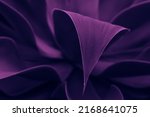 intense blue and violet tropical plant glowing neon. exquisite leaves close up, abstract nature background, dark blue and purple toned. Leaf details. Future, exotic, trendy concept. daring color. lush