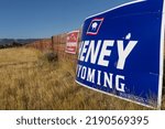 Small photo of Casper, WY USA 08 16 2022: Campaign signs for Liz Cheney (R WY) and her Republican primary opponent Harriet Hageman dot the City of Casper