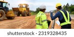 Small photo of Asian surveyor engineer two people checking level of soil with Surveyor's Telescope equipment to measure leveling for cut and fill, started leveling the ground at the highway road construction site.