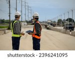 Small photo of Highway engineers discuss plans for construction improvement based on roadworks. Soil Fill, Backfill Compaction for Sub base, Base Course, Surveyor Engineer inspector in highway construction.