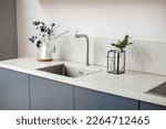 Small photo of Modern kitchen interior in scandinavian style and gray tones. Kitchen worktop.