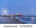 Steel Pier With Reflection At...