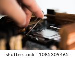 stock-photo-computer-engineer-maintenance-computer-cpu-hardware-upgrade-of-motherboard-component-pc-repair-by-1085309465.jpg