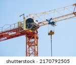 Small photo of Close up details with a cabin control of a construction crane.Turret Slewing Crane against blue sky