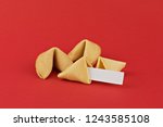 Traditional  Chinese new year fortune cookies on red background with white paper for text