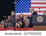 Small photo of Battle Creek, Michigan / United States - December 18, 2019: President Trump with Republican National Convention Chair Ronna Romney McDaniel and Michigan Republican Party Cochair Terry Bowman