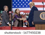 Small photo of Battle Creek, Michigan / United States - December 18, 2019: President Trump with Republican National Convention Chair Ronna Romney McDaniel and Michigan Republican Party Cochair Terry Bowman