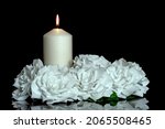 Small photo of LIGHTED CANDLE AND ELEGANT WHITE ROSES ARRANGEMENT ON DARK BACKGROUND. ALL SOULS DAY, DEATH, DECEASE, PRAYER, MEMORIAL DAY, DUEL, MOURNING, GRAVE, CEMETERY, BURIAL, CONDOLENCE AND FUNERAL CONCEPT.