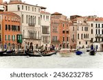 Small photo of Venice, Italy - Sept.22, 2023: Venice's Grand Canal and other waterways are filled with a wide variety of water traffic including iconic gondolas, sleek motorboats, vaporetto water busses and ferries.