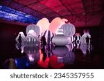 Small photo of Madrid, Spain. July 6, 2023 Pop Air Balloon Museum Young Contemporary exhibition with unusual colorful balloon objects. The visitors on the exhibition in a dark. Light show with figures. Lighted show.