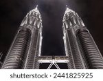 Small photo of Kuala Lumpur Malaysia - March,15 2024 : Cityscape of Petronas Twin Towers or KLCC Twin Towers, Night view of the Petronas Twin Towers at KLCC City Center. The most popular tourist destination
