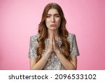 Small photo of Please beg you. Clingy silly miserable supplicating young cute female curly-haired praying whining about cry press palms together asking please do favor need help, standing pink background