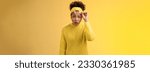 Small photo of Concerned amazed speechless african-american student girl drop jaw take-off glasses widen eyes surprised been dropped-out look unbelievable thing, standing questioned frustrated, yellow background.