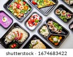 Catering food with healthy balanced diet delicious lunch box boxed take away deliver packed ready  meal in black container dinner, meal, brakfast