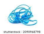 Blue earbuds isolated on white background. Tangled and twisted wire headphones.
