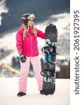 Small photo of Girl snowboarding in the mountains with the snowboard