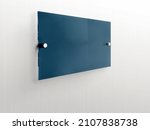 Dark blue rectangle Transparent glass nameplate plate on spacer metal holders. Clear printing board for branding. Acrylic dark advertising signboard on white background mock-up side view.