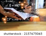 Physics equations floating in the background, hands writing in notebooks on wooden tables, representing the learning teaching or scientific notes of Albert Einstein and Sir Isaac Newton or physics all