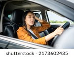 Small photo of Young asian woman has broken down car on the road she feeling serious and stressed.Look for someone help. Driving during rush hour But the traffic is very congested. Shocked face