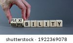 Small photo of Flexibility and adaptability symbol. Businessman turns wooden cubes and changes words 'adaptability' to 'flexibility'. Grey background, copy space. Business, flexibility and adaptability concept.