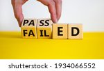 Small photo of Passed or failed symbol. Businessman turns wooden cubes and changes the word 'failed' to 'passed' on a beautiful yellow table, white background. Business and passed or failed concept. Copy space.