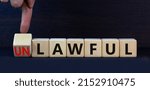 Small photo of Lawful or unlawful symbol. Turned wooden cubes and changed the concept word Unlawful to Lawful. Beautiful grey table grey background, copy space. Business and lawful or unlawful concept.