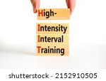 Small photo of HIIT high-intensity interval training symbol. Concept words HIIT high-intensity interval training on blocks on a beautiful white background. HIIT high-intensity interval training concept. Copy space.