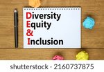 Small photo of DEI, Diversity equity and inclusion symbol. Concept words DEI diversity equity and inclusion on the note on beautiful white background. Business DEI diversity equity and inclusion concept.
