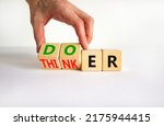 Small photo of Doer or thinker symbol. Concept words Doer or thinker on wooden cubes. Businessman hand. Beautiful white table white background. Business and doer or thinker concept. Copy space.