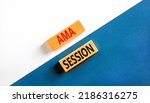 Small photo of AMA ask me anything session symbol. Concept words AMA ask me anything session on wooden blocks on a beautiful white and blue background. Business and AMA ask me anything session concept. Copy space.