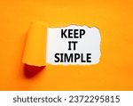 Small photo of Keep it simple symbol. Concept word Keep it simple on beautiful white paper. Beautiful orange table orange background. Business motivational keep it simple concept. Copy space.