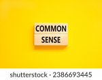Common sense symbol. Concept words Common sense on beautiful wooden block. Beautiful yellow table yellow background. Business, motivational common sense concept. Copy space.