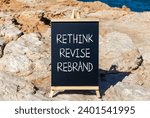 Small photo of Rethink revise rebrand symbol. Concept word Rethink Revise Rebrand on blackboard. Beautiful stone beach sea blue background. Business brand motivational rethink revise rebrand concept. Copy space.