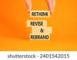 Small photo of Rethink revise rebrand symbol. Concept word Rethink Revise and Rebrand on beautiful block. Beautiful orange background. Business brand motivational rethink revise rebrand concept. Copy space.