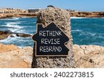 Small photo of Rethink revise rebrand symbol. Concept word Rethink Revise Rebrand on blackboard. Beautiful stone beach sea blue sky background. Business brand motivational rethink revise rebrand concept. Copy space.