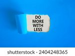 Small photo of Do more with less symbol. Concept word Do more with less on beautiful white paper. Beautiful blue paper background. Business do more with less concept. Copy space.