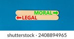 Small photo of Moral or legal symbol. Concept word Moral or Legal on beautiful wooden stick. Beautiful blue table blue background. Business and moral or legal concept. Copy space.